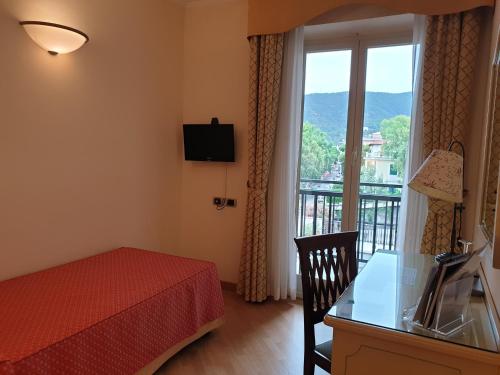 a bedroom with a bed and a window with a view at Grande Albergo in Sestri Levante