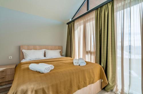 Postel nebo postele na pokoji v ubytování GVC 3-room 2-level apt New Gudauri