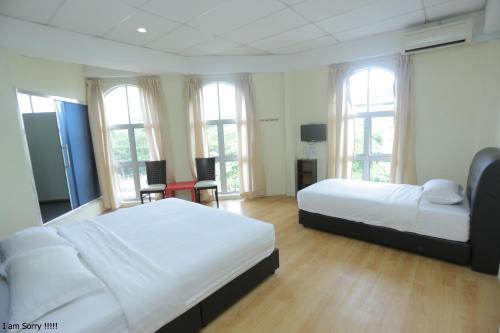 Postel nebo postele na pokoji v ubytování JAM Hotel Kota Warisan Sepang @ ERL Salak Tinggi, KLIA 1-2 & F1