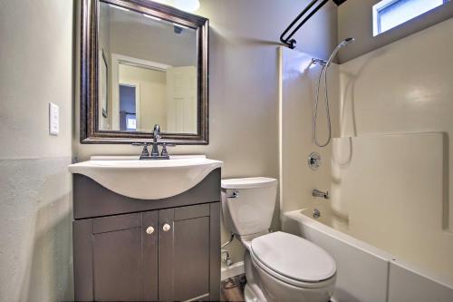 a bathroom with a sink and a toilet and a mirror at Cozy Cabin with Deck and Fireplace in Big Bear! in Big Bear City