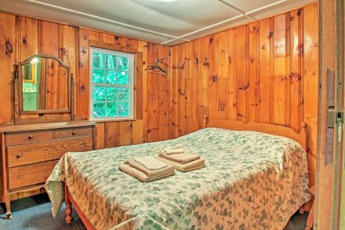 A bed or beds in a room at Lake Stinson Cottage with Sunroom and Shared Dock!