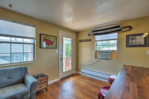 a living room with a couch and a table at Winslow Apartment with Jacuzzi, Deck and Grill Access! in Winslow