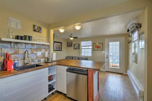 a kitchen with a sink and a counter top at Winslow Apartment with Jacuzzi, Deck and Grill Access! in Winslow