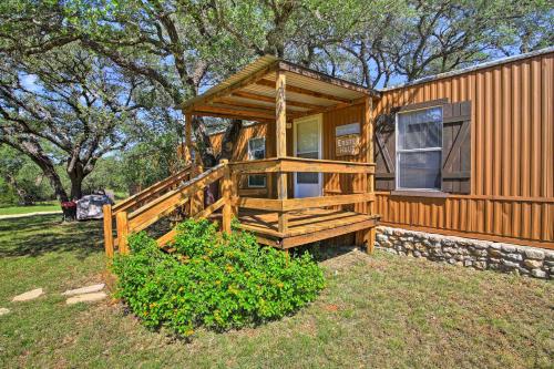 a log cabin with a porch and a porch at Quiet Utopia Cabin with Deck and Mountain Views! in Utopia
