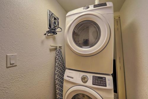 a washing machine in a corner of a room at Winslow Apartment with Jacuzzi, Deck and Grill Access! in Winslow