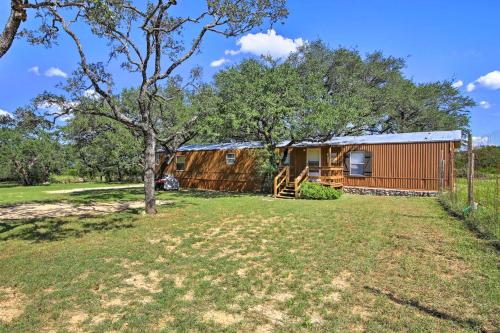 a barn with a yard in front of it at Quiet Utopia Cabin with Deck and Mountain Views! in Utopia