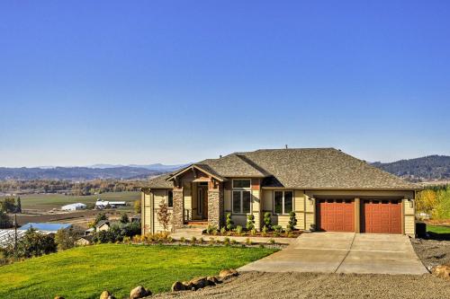 a home with a view of the mountains at Chic Willamette Valley Home with Deck and Vineyard! in Gaston