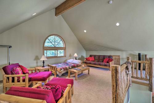 a living room filled with furniture and a window at Kalispell Riverfront Home by Glacier National Park in Kalispell