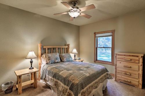 a bedroom with a bed and a ceiling fan at Kalispell Riverfront Home by Glacier National Park in Kalispell