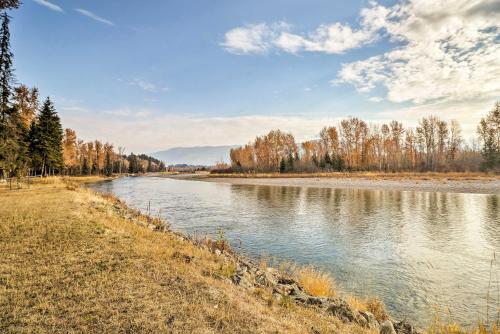 a river with trees on the side of it at Kalispell Riverfront Home by Glacier National Park in Kalispell