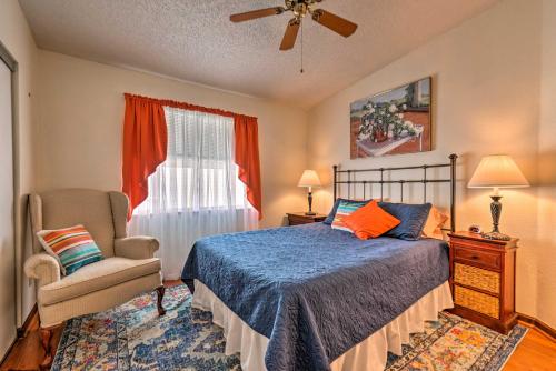 a bedroom with a bed and a chair and a window at Lovely Lady Lake Home with Resort Amenities and Lanai! in Lady Lake