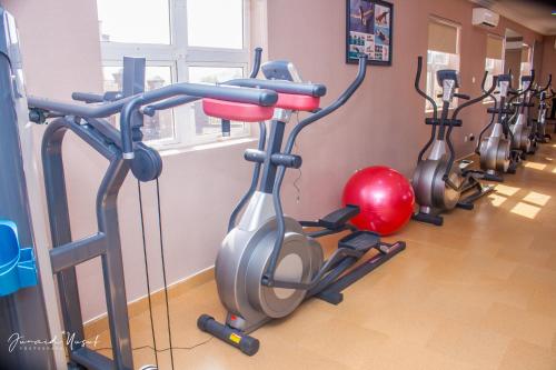 a row of exercise bikes in a gym at Conference Hotel , Abeokuta in Abeokuta
