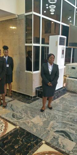 a group of women in suits standing in a lobby at Conference Hotel , Abeokuta in Abeokuta