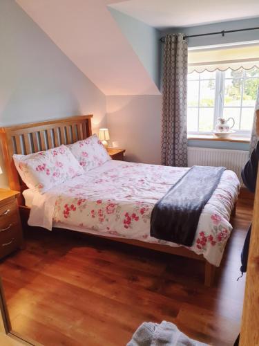 Postel nebo postele na pokoji v ubytování Nellies Cottage B&B