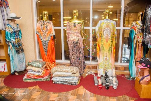 a display of dresses in a store window at Conference Hotel , Abeokuta in Abeokuta