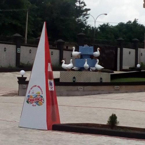 a small sail boat in front of a fountain at Conference Hotel , Abeokuta in Abeokuta