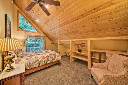 a bedroom with a bed and a ceiling fan at Lakeside Sagle Home with Dock-by Schweitzer Mtn! in Sagle