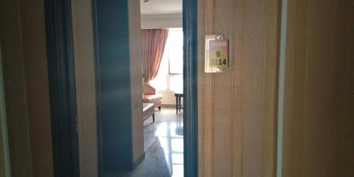 a room with a door open to a room with a room at Conference Hotel , Abeokuta in Abeokuta