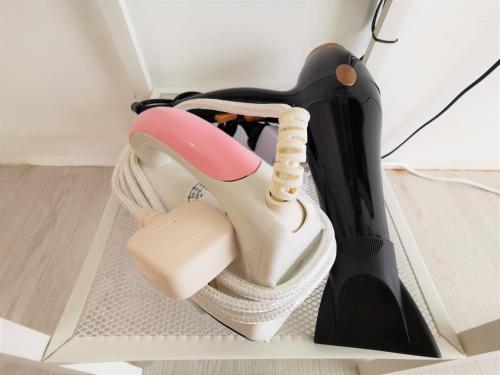 a pair of shoes in a box at Infistay Homestay - Sunway Geo Avenue, Sunway Pyramid, Sunway Lagoon, Sunway University, Sunway Medical Centre in Subang Jaya