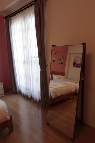 Ένα ή περισσότερα κρεβάτια σε δωμάτιο στο Jin Du Yi Yuan B & B