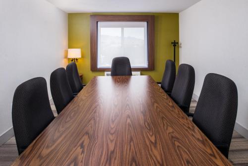 a conference room with a wooden table and chairs at Holiday Inn Express Sierra Vista by IHG in Sierra Vista