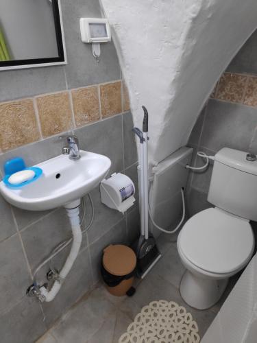 a bathroom with a sink and a toilet at Dar Jacaman - In the heart of Bethlehem old city in Bethlehem