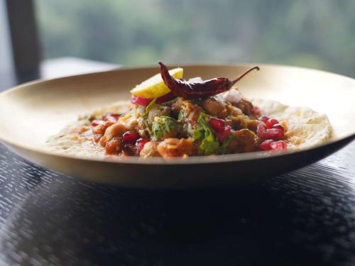 a plate of food sitting on a table at Novotel Chennai Sipcot in Chennai