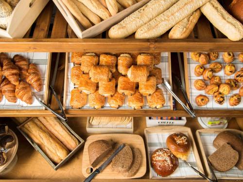 a display of bread and pastries in a bakery at Novotel Tunis in Tunis