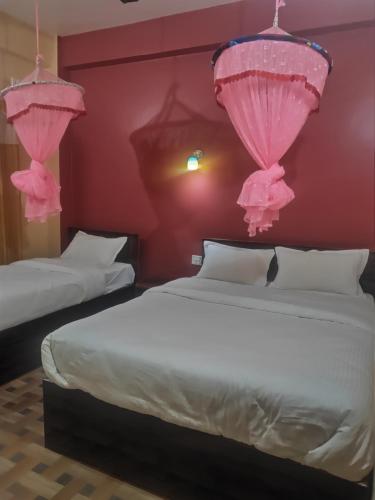 Katil atau katil-katil dalam bilik di Hotel Sweetland