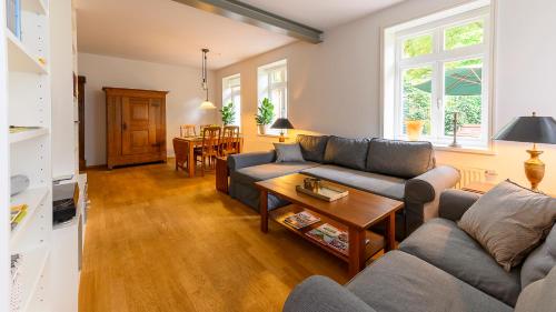 a living room with a couch and a table at Altstadt Apartments Verden in Verden