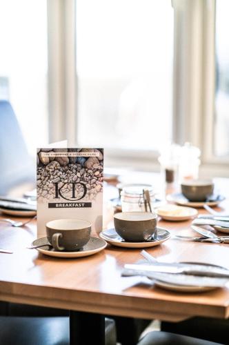 a box on a table with cups and plates at The Kingswood Hotel in Sidmouth