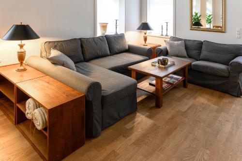 a living room with a couch and a table at Altstadt Apartments Verden in Verden