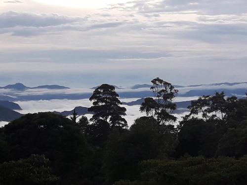 a view of the mountains with trees and clouds at Condominio Hacienda Shangrila in San Francisco