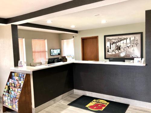 a waiting area at a fast food restaurant at Super 8 by Wyndham Natchitoches in Natchitoches