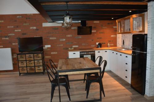 Kuchyň nebo kuchyňský kout v ubytování LoftStyle Apartament 2