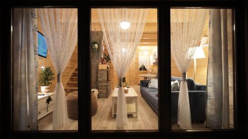 a view of a living room from a window at Wioska Jasia i Małgosi in Izdebnik