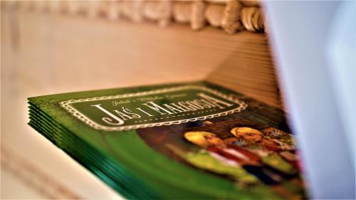 a book sitting on a shelf in a refrigerator at Wioska Jasia i Małgosi in Izdebnik