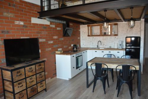 Kuchyň nebo kuchyňský kout v ubytování LoftStyle Apartament 2