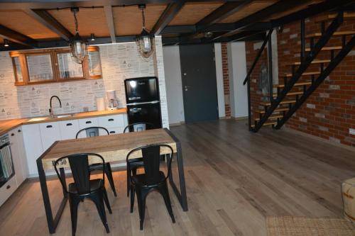 Kuchyň nebo kuchyňský kout v ubytování LoftStyle Apartament 2
