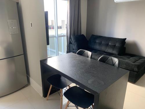 Posezení v ubytování OCEAN LIFE excelente apartamento 1 dormitório