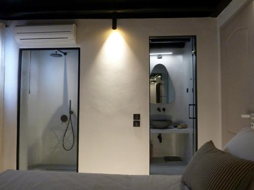 a bathroom with a shower and a mirror at VILLA 11.7 in Elia Beach