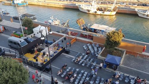 an overhead view of a restaurant with tables and chairs near the water at la Dimora del Borgo in Fiumicino
