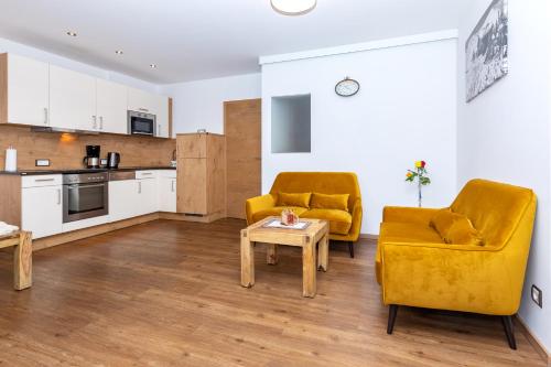 
a living room filled with furniture and appliances at Appartement Living Schönwies in Zell am See
