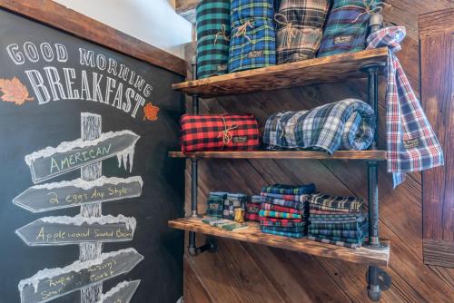 a room with wooden shelves and signs on a wall at The Barnstead Inn in Manchester Center