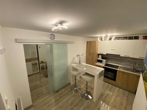 a kitchen with a sink and a counter in it at Apartman Bilivano in Zagreb