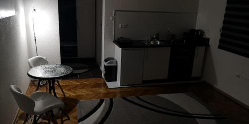 Kuchyň nebo kuchyňský kout v ubytování Apartment Cakic