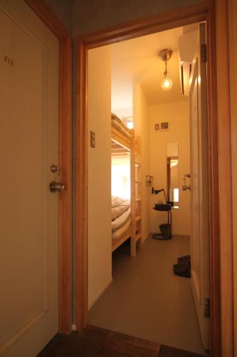 Postel nebo postele na pokoji v ubytování guesthouse SHIBAFU