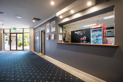 a lobby of a mcdonalds restaurant with a counter at Nightcap at Springwood Hotel in Springwood