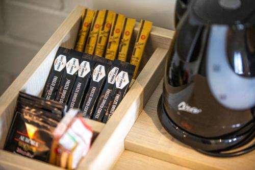 a wooden box with books and a coffee pot at Nightcap at Springwood Hotel in Springwood