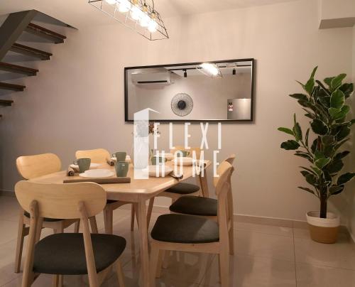 a dining room with a table and chairs at NETFLIX-Pinnacle PJ, Fantastic City View, 1-6 Guests Designed Duplex Home by Flexihome-MY in Petaling Jaya